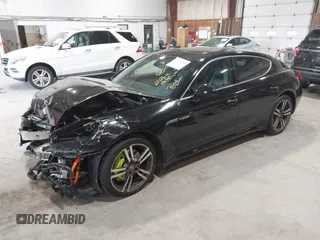 2016 Porsche Panamera S E-Hybrid z VIN WP0AD2A74GL040039, wystawiony jako IAAI lot #42411042 z przebiegiem 60 616 mil mil oraz . Historia ofert i sprzedaży dostępna na DreamBid. Obrazek 2.