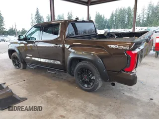 2023 Toyota Tundra Limited with VIN 5TFJA5DB9PX125400, listed as a IAAI auction lot 41336129 with 12,384 mi miles and . Bid and sale history available at DreamBid. Image 3.