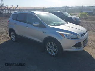 2016 Ford Escape Titanium with VIN 1FMCU9JX2GUA50916, listed as a IAAI auction lot 42118711 with 121,405 mi miles. Bid and sale history available at carsss.com. Image 1.