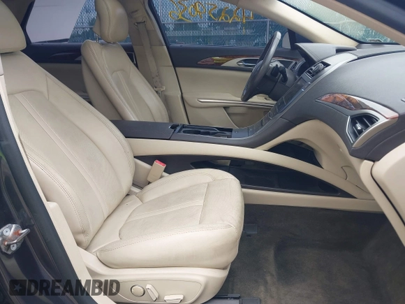 2013 Lincoln MKZ z VIN 3LN6L2G90DR827936, wystawiony jako IAAI lot #42259036 z przebiegiem 145 304 mil mil oraz . Historia ofert i sprzedaży dostępna na DreamBid. Obrazek 5.