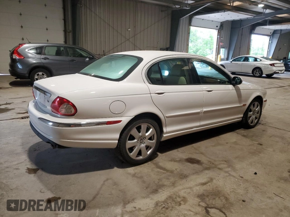 2004 Jaguar X-Type with VIN SAJEA51C34WE06046, listed as a Copart auction lot 56982105 with 69,265 mi miles and Clean Title. Bid and sale history available at DreamBid. Image 3.