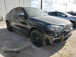 2017 BMW X4 M40i with VIN 5UXXW7C51H0U25766, listed as a Copart auction lot 77749324 with 101,289 mi miles and Salvage Title. Bid and sale history available at carsss.com. Image 4.