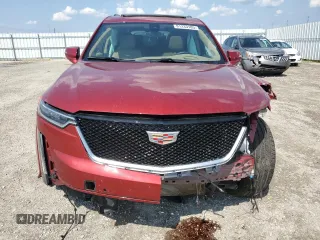 2024 Cadillac XT6 AWD Sport z VIN 1GYKPHRS0RZ724524, wystawiony jako Copart lot #61333185 z przebiegiem 12 799 mil mil oraz Nie do naprawy • Non repairable. Historia ofert i sprzedaży dostępna na DreamBid. Obrazek 5.