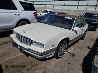 1991 Cadillac Eldorado z VIN 1G6EL13B2MU602660, wystawiony jako Copart lot #67365674 z przebiegiem 108 880 mil mil oraz Szkody całkowita. Historia ofert i sprzedaży dostępna na DreamBid. Obrazek 1.