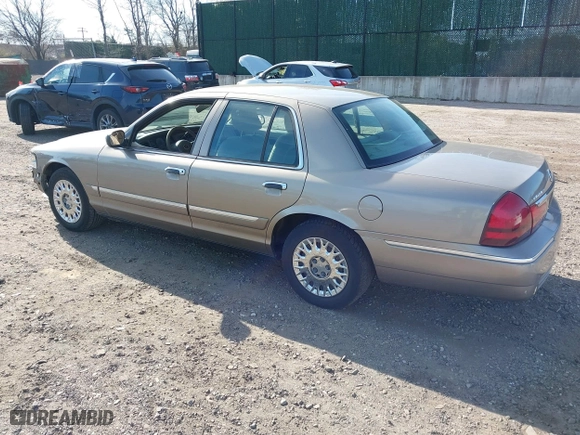 2003 Mercury Grand Marquis GS Convenience with VIN 2MEFM74W43X681774, listed as a IAAI auction lot 42057422 with 218,422 mi miles. Bid and sale history available at carsss.com. Image 3.