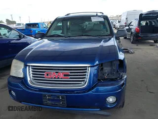 2006 GMC Envoy SLE with VIN 1GKDS13S562252049, listed as a IAAI auction lot 41940052 with 149,445 mi miles. Bid and sale history available at carsss.com. Image 13.