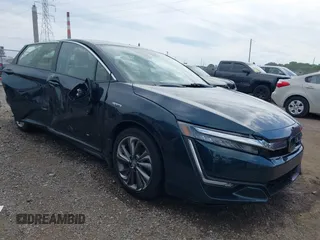 2018 Honda Clarity Touring z VIN JHMZC5F32JC012663, wystawiony jako IAAI lot #42520442 z przebiegiem 65 282 mil mil oraz . Historia ofert i sprzedaży dostępna na DreamBid. Obrazek 1.