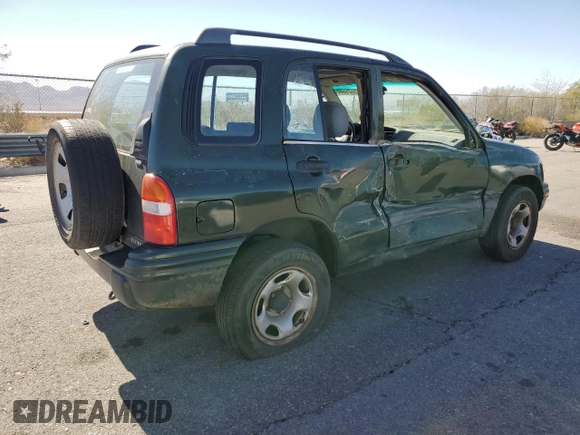 2000 Suzuki Vitara JX z VIN 2S3TD52V1Y6108459, wystawiony jako Copart lot #75526644 z przebiegiem 263 433 mil mil oraz Szkody całkowita. Historia ofert i sprzedaży dostępna na DreamBid. Obrazek 3.
