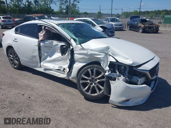 2016 Mazda Mazda6 i Grand Touring with VIN JM1GJ1W55G1443186, listed as a IAAI auction lot 42063716 with 114,263 mi miles. Bid and sale history available at carsss.com. Image 1.