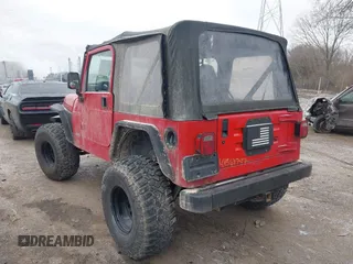 2002 Jeep Wrangler X z VIN 1J4FA39S52P708519, wystawiony jako IAAI lot #41569747 z przebiegiem 219 168 mil mil oraz . Historia ofert i sprzedaży dostępna na DreamBid. Obrazek 3.