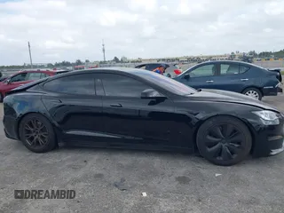 2023 Tesla Model S with VIN 5YJSA1E53PF510757, listed as a IAAI auction lot 42075624 with Not provided miles and . Bid and sale history available at DreamBid. Image 14.
