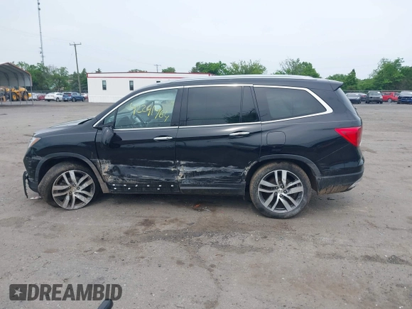 2017 Honda Pilot Touring with VIN 5FNYF6H90HB052474, listed as a IAAI auction lot 42291464 with 103,288 mi miles and . Bid and sale history available at DreamBid. Image 14.