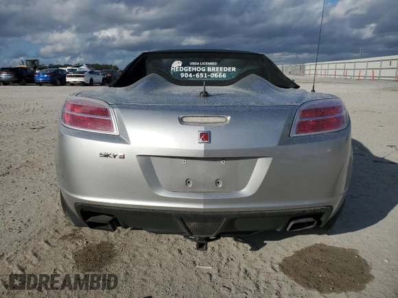 2009 Saturn Sky Red Line z VIN 1G8MT35X69Y104310, wystawiony jako Copart lot #87369754 z przebiegiem 62 428 mil mil oraz Szkody całkowita. Historia ofert i sprzedaży dostępna na DreamBid. Obrazek 6.
