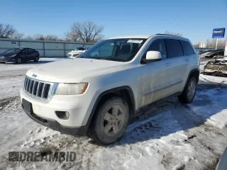 2012 Jeep Grand Cherokee Laredo with VIN 1C4RJFAG2CC267890, listed as a Copart auction lot 87832115 with 171,552 mi miles and Salvage Title. Bid and sale history available at carsss.com. Image 1.