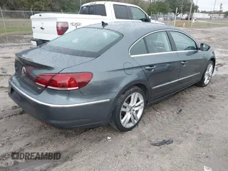 2014 Volkswagen CC Lux with VIN WVWRP7AN6EE520381, listed as a IAAI auction lot 41338169 with 130,363 mi miles. Bid and sale history available at carsss.com. Image 4.