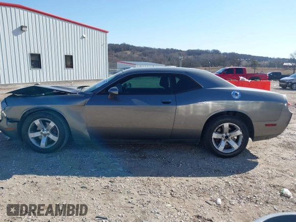 2011 Dodge Challenger z VIN 2B3CJ4DG3BH512974, wystawiony jako IAAI lot #41431931 z przebiegiem 186 845 mil mil oraz . Historia ofert i sprzedaży dostępna na DreamBid. Obrazek 14.