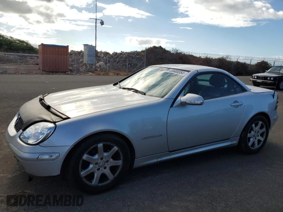 2002 Mercedes-Benz SLK-Class 2.3L Kompressor with VIN WDBKK49FX2F242987, listed as a Copart auction lot 65685554 with 96,461 mi miles and Salvage Title. Bid and sale history available at carsss.com. Image 1.