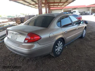 2002 Ford Taurus LX with VIN 1FAFP52U72G284116, listed as a IAAI auction lot 42004075 with 86,544 mi miles. Bid and sale history available at carsss.com. Image 4.