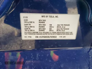 2020 Tesla Model Y Long Range z VIN 5YJYGDEE8LF029553, wystawiony jako Copart lot #51010665 z przebiegiem 42 877 mil mil oraz Szkoda całkowita • Salvage title. Historia ofert i sprzedaży dostępna na DreamBid. Obrazek 13.