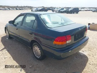 1997 Honda Civic DX with VIN 2HGEJ6623VH528179, listed as a IAAI auction lot 41756380 with 155,741 mi miles. Bid and sale history available at carsss.com. Image 3.