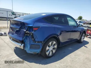 2024 Tesla Model Y z VIN 7SAYGDED9RF005104, wystawiony jako Copart lot #64974545 z przebiegiem 20 422 mil mil oraz Szkoda całkowita • Salvage title. Historia ofert i sprzedaży dostępna na DreamBid. Obrazek 3.