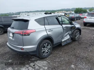 2018 Toyota RAV4 LE with VIN JTMBFREV8JJ200930, listed as a IAAI auction lot 42524876 with 88,015 mi miles and . Bid and sale history available at DreamBid. Image 4.