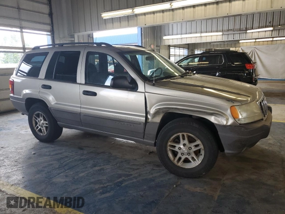 2003 Jeep Grand Cherokee Laredo with VIN 1J4GW48S43C567559, listed as a Copart auction lot 61431595 with 249,998 mi miles and Salvage title. Bid and sale history available at DreamBid. Image 4.