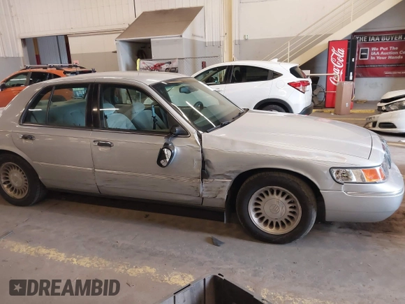 2000 Mercury Grand Marquis LS z VIN 2MEFM75W0YX736324, wystawiony jako IAAI lot #41865927 z przebiegiem 136 886 mil mil oraz . Historia ofert i sprzedaży dostępna na DreamBid. Obrazek 13.