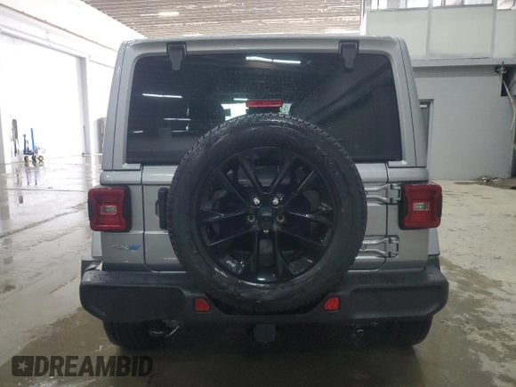 2021 Jeep Wrangler Unlimited Sahara with VIN 1C4JJXP65MW682462, listed as a Copart auction lot 58673385 with 38,714 mi miles and Salvage title. Bid and sale history available at DreamBid. Image 6.