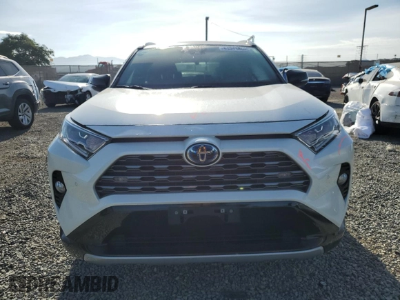 2021 Toyota RAV4 Hybrid XSE with VIN 2T3E6RFV1MW018990, listed as a Copart auction lot 64043865 with 55,938 mi miles and Salvage title. Bid and sale history available at DreamBid. Image 5.