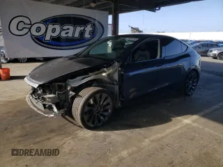 2022 Tesla Model Y Performance z VIN 7SAYGDEF9NF411721, wystawiony jako Copart lot #56961145 z przebiegiem 42 499 mil mil oraz Szkoda całkowita • Salvage title. Historia ofert i sprzedaży dostępna na DreamBid. Obrazek 1.