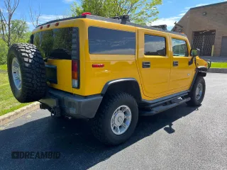 2003 Hummer H2 with VIN 5GRGN23UX3H112710, listed as a Copart auction lot 72082654 with 64,186 mi miles and Salvage Title. Bid and sale history available at carsss.com. Image 4.