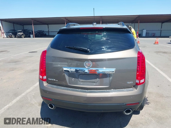 2015 Cadillac SRX Performance Collection with VIN 3GYFNFE35FS569682, listed as a IAAI auction lot 42322229 with 124,365 mi miles and . Bid and sale history available at DreamBid. Image 16.