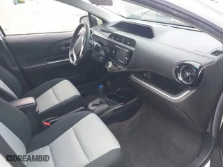 2015 Toyota Prius c One with VIN JTDKDTB3XF1097538, listed as a IAAI auction lot 42031057 with 100,847 mi miles. Bid and sale history available at carsss.com. Image 5.