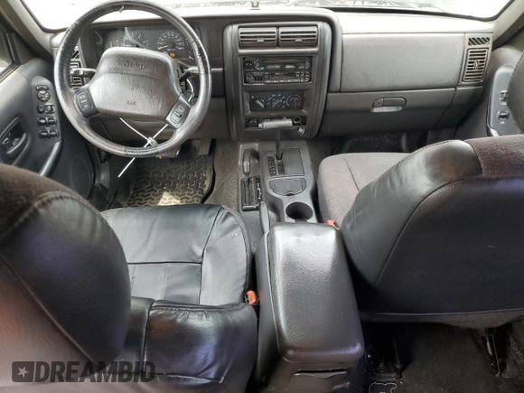 1999 Jeep Cherokee Sport with VIN 1J4FF68S9XL635836, listed as a Copart auction lot 59573195 with 187,035 mi miles and Salvage title. Bid and sale history available at DreamBid. Image 8.