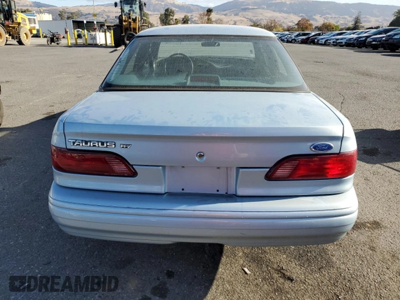 1993 Ford Taurus with VIN 1FACP5216PG197713, listed as a Copart auction lot 80982424 with 79,330 mi miles and Salvage title. Bid and sale history available at DreamBid. Image 6.