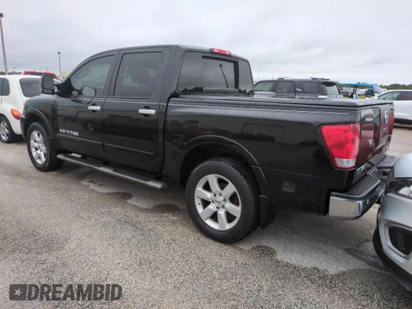 2010 Nissan Titan LE with VIN 1N6BA0EC8AN318538, listed as a Copart auction lot 74122194 with Not Provided miles and Salvage Title. Bid and sale history available at carsss.com. Image 2.