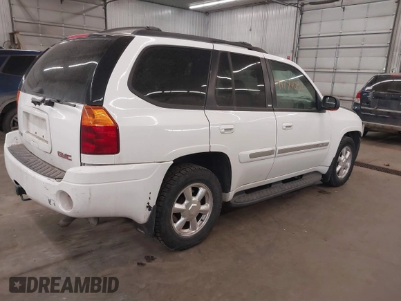 2003 GMC Envoy SLT with VIN 1GKDT13S332222847, listed as a IAAI auction lot 41771052 with 203,699 mi miles. Bid and sale history available at carsss.com. Image 4.