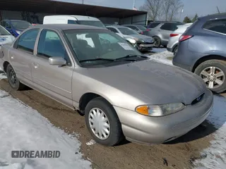 1996 Ford Contour LX with VIN 1FALP6530TK105053, listed as a IAAI auction lot 41287231 with 115,177 mi miles and . Bid and sale history available at DreamBid. Image 1.