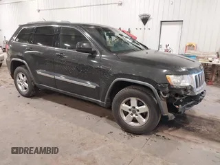 2011 Jeep Grand Cherokee 70th Anniversary with VIN 1J4RR4GG3BC745652, listed as a IAAI auction lot 41133698 with 217,948 mi miles. Bid and sale history available at carsss.com. Image 1.