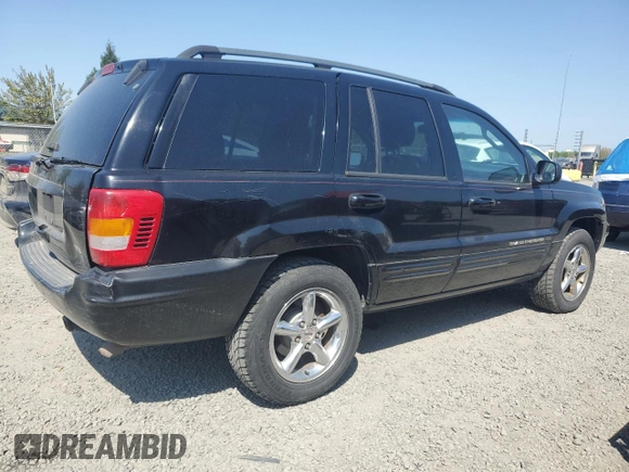 2002 Jeep Grand Cherokee Limited with VIN 1J8GW58NX2C158544, listed as a Copart auction lot 54937665 with 259,089 mi miles and Salvage title. Bid and sale history available at DreamBid. Image 3.