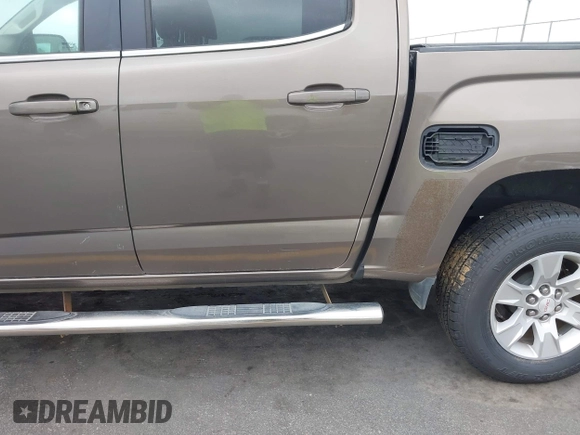 2015 GMC Canyon 2WD SLE with VIN 1GTG5BE38F1229799, listed as a IAAI auction lot 41944801 with 71,165 mi miles. Bid and sale history available at carsss.com. Image 19.