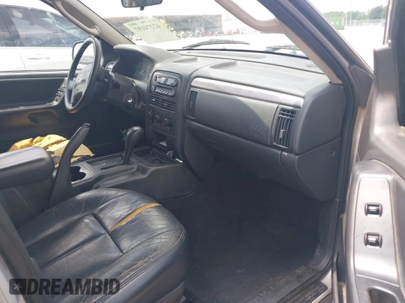 2004 Jeep Grand Cherokee Laredo with VIN 1J4GX48N04C435603, listed as a IAAI auction lot 42274197 with 256,163 mi miles and . Bid and sale history available at DreamBid. Image 5.