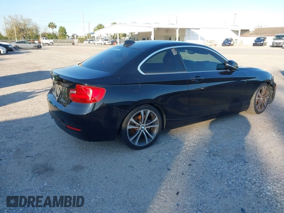2015 BMW 2 Series 228i with VIN WBA1F5C58FV257021, listed as a IAAI auction lot 41318026 with 154,906 mi miles. Bid and sale history available at carsss.com. Image 4.