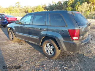 2007 Jeep Grand Cherokee Laredo with VIN 1J8GS48K17C655999, listed as a IAAI auction lot 41590500 with 290,695 mi miles. Bid and sale history available at carsss.com. Image 3.