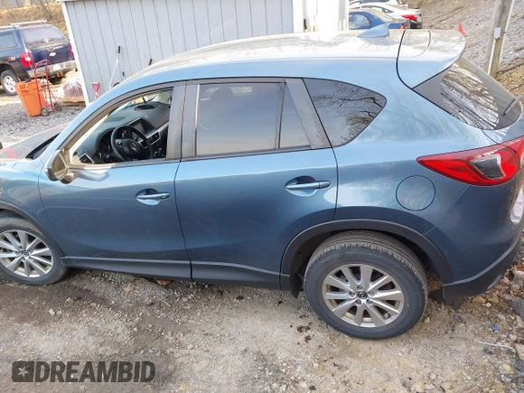 2016 Mazda CX-5 Touring with VIN JM3KE4CY5G0771252, listed as a IAAI auction lot 42138637 with 106,767 mi miles and . Bid and sale history available at carsss.com. Image 14.