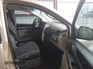 2010 Dodge Grand Caravan SXT with VIN 2D4RN5D17AR496854, listed as a IAAI auction lot 42210738 with 213,121 mi miles and . Bid and sale history available at DreamBid. Image 5.