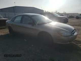 2003 Ford Taurus z VIN 1FAFP52253A170456, wystawiony jako Copart lot #70009824 z przebiegiem 216 567 mil mil oraz Szkoda całkowita • Salvage title. Historia ofert i sprzedaży dostępna na DreamBid. Obrazek 4.