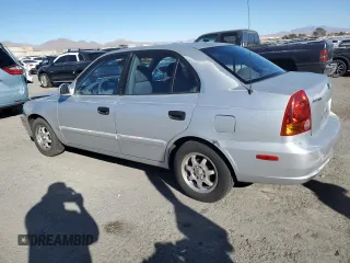 2003 Hyundai Accent GL z VIN KMHCG45C63U413388, wystawiony jako Copart lot #88979235 z przebiegiem 240 928 mil mil oraz Szkoda całkowita • Salvage title. Historia ofert i sprzedaży dostępna na DreamBid. Obrazek 2.