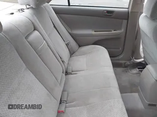 2003 Toyota Camry LE z VIN 4T1BF30K93U044730, wystawiony jako IAAI lot #42044599 z przebiegiem 120 401 mil mil oraz . Historia ofert i sprzedaży dostępna na DreamBid. Obrazek 8.